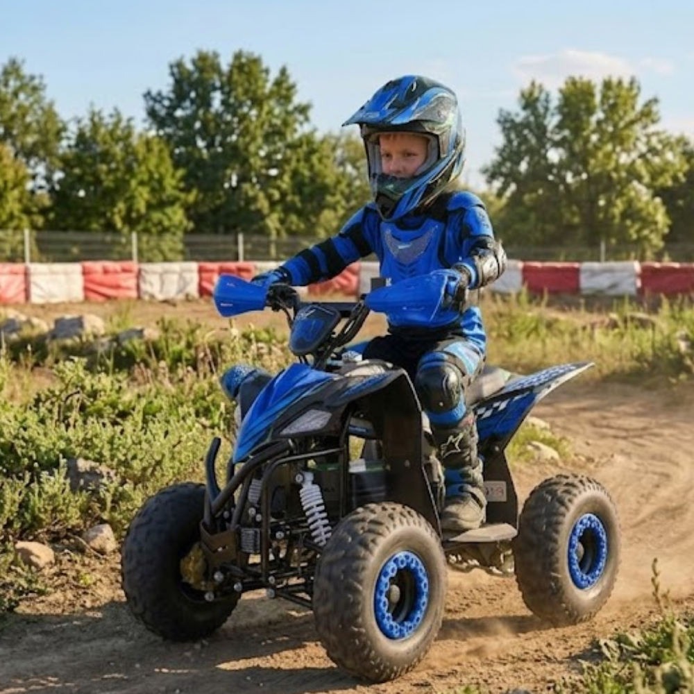 Child riding a blue ATV on a dirt track with trees in the background