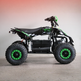 Black and green ATV on a gray surface with a gradient background