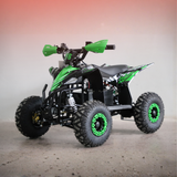 Green and black ATV on a gray surface with a gradient background