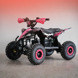 Pink and black ATV on a gray floor with a gradient wall background