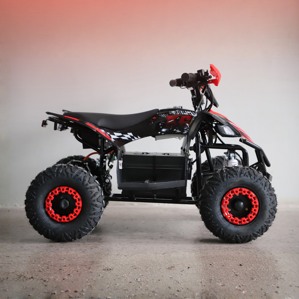 Black and red ATV on a gray surface with a gradient background