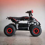 Black and red ATV on a gray surface with a gradient background