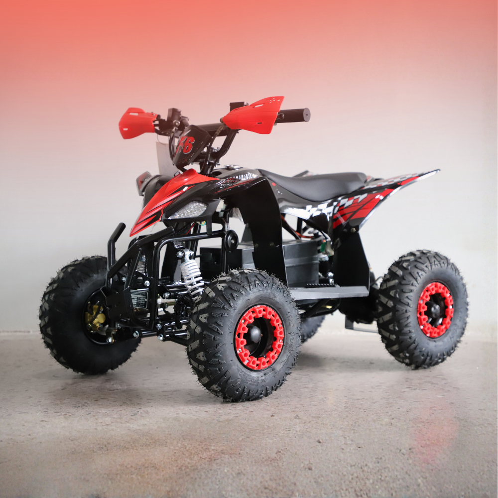 Red and black ATV on a gray surface with a gradient background