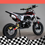 A back-right angled view of the dirt bike, showcasing the exhaust pipe and rear suspension, on a checkered background