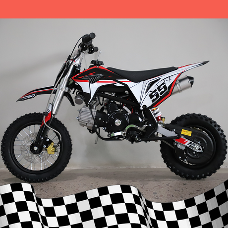 A full left-side view of the dirt bike, highlighting the frame and exhaust system against a checkered base background.