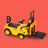 A yellow and black ride-on toy forklift with a black seat, steering wheel, and front pallet fork, shown on a solid red background.