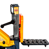 Close-up of a yellow and black industrial lift or pallet platform with an orange side panel and a black slatted platform, shown on a white background.