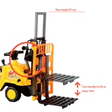 A yellow and black toy forklift shown on a white background with red instructional text and arrows indicating height and fork-lifting orientation. The forklift is cropped on the left, and the diagram highlights the mast, handle, and pallet forks.