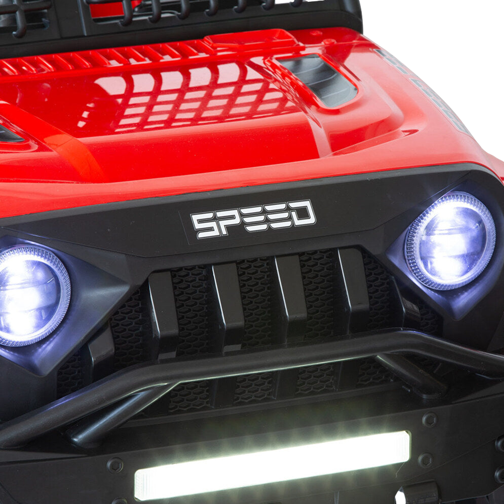 Close-up of the front grille of the red Jeep-inspired remote-controlled ride-on electric car, with illuminated headlights and the "SPEED" logo