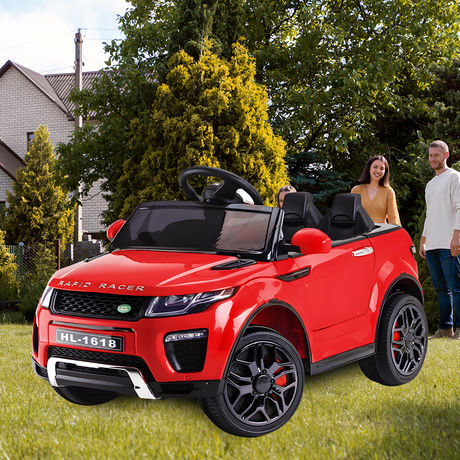 red ride on car on greeny grass