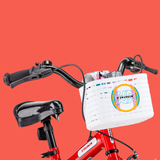 Red bicycle with a white basket featuring the Trinx logo on a red background