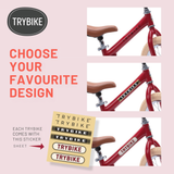Red bicycle with TRYBIKE branding on a pink background, featuring text and a sticker sheet.