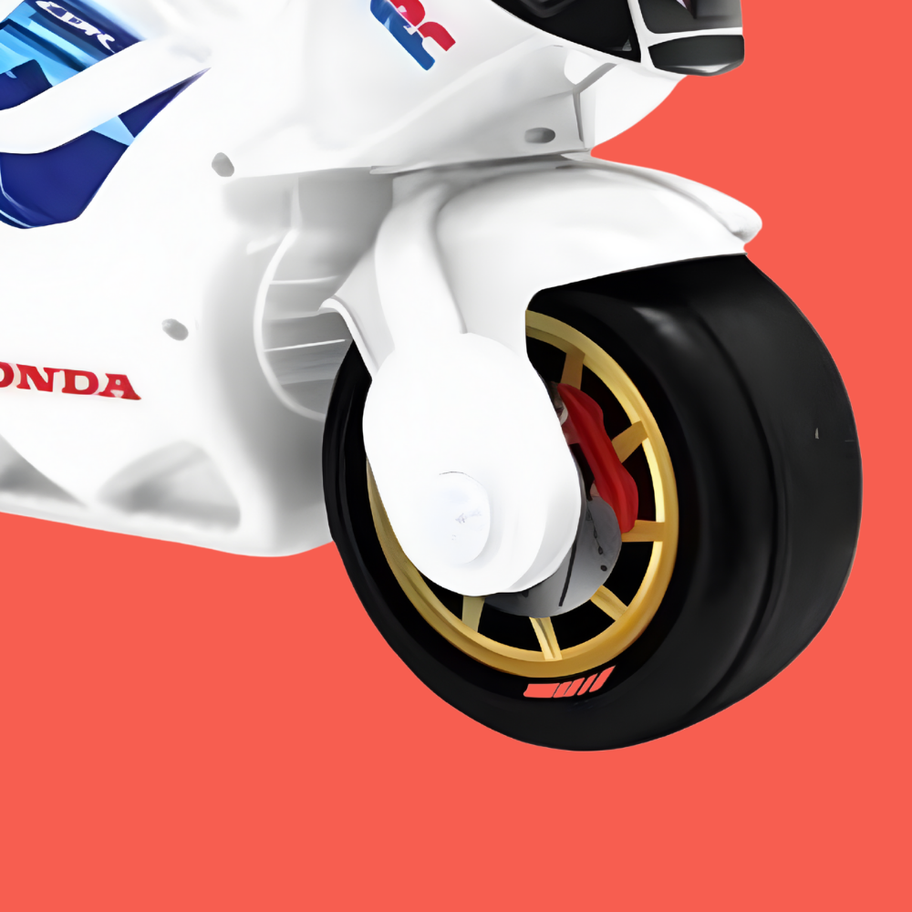 Close-up of a motorcycle wheel with visible branding on a red background