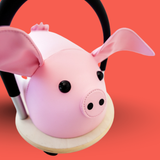Pink pig-shaped headband on a red background