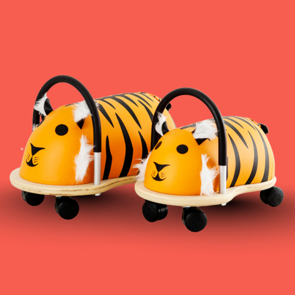 Two tiger-themed children's ride-on toys on a red background