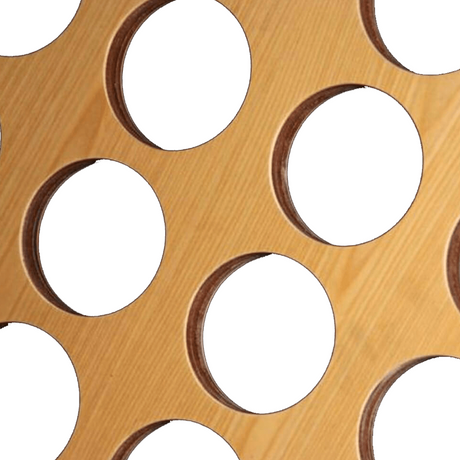 Close-up view of a wooden Giant 4 game board showing the circular holes.