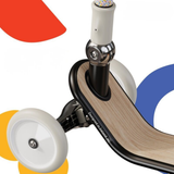 Close-up of a scooter with colorful wheels on a white background