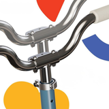 Close-up of bicycle handlebars with colorful geometric shapes on a white background