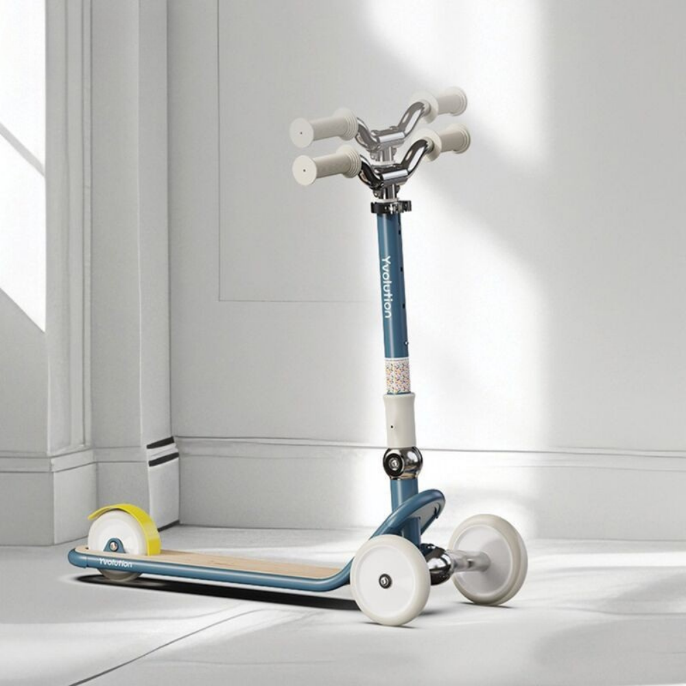 Children's scooter with a blue handlebar and white wheels on a light gray floor.