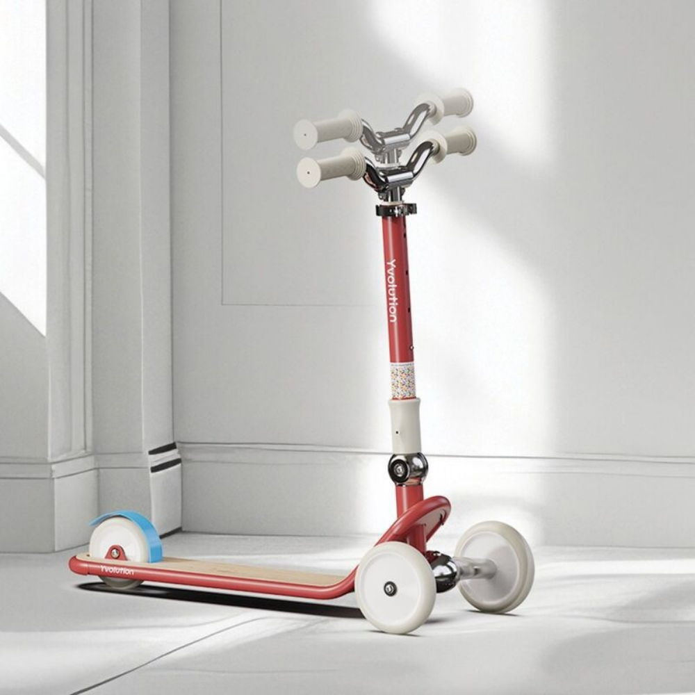 Red scooter with white wheels on a light gray floor