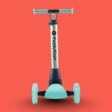 Children's scooter with teal handlebars and wheels on a red background