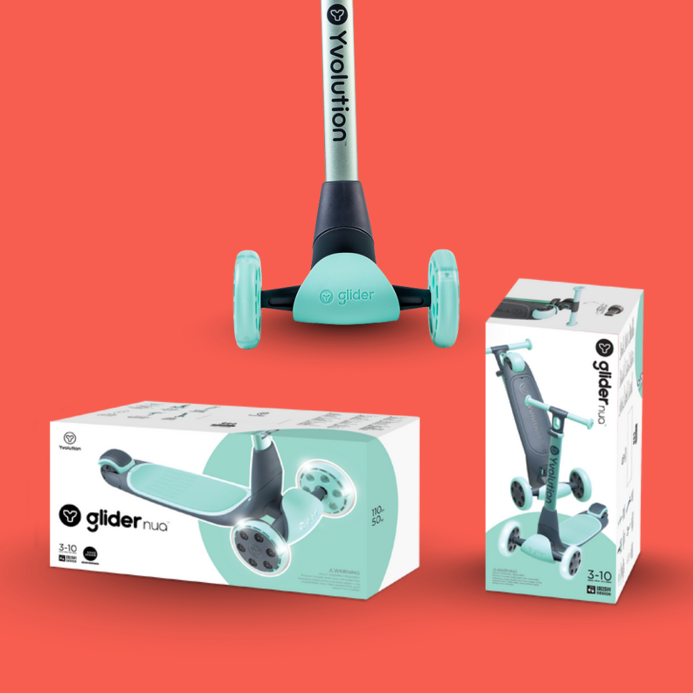 Children's scooter with two packaging boxes on a red background