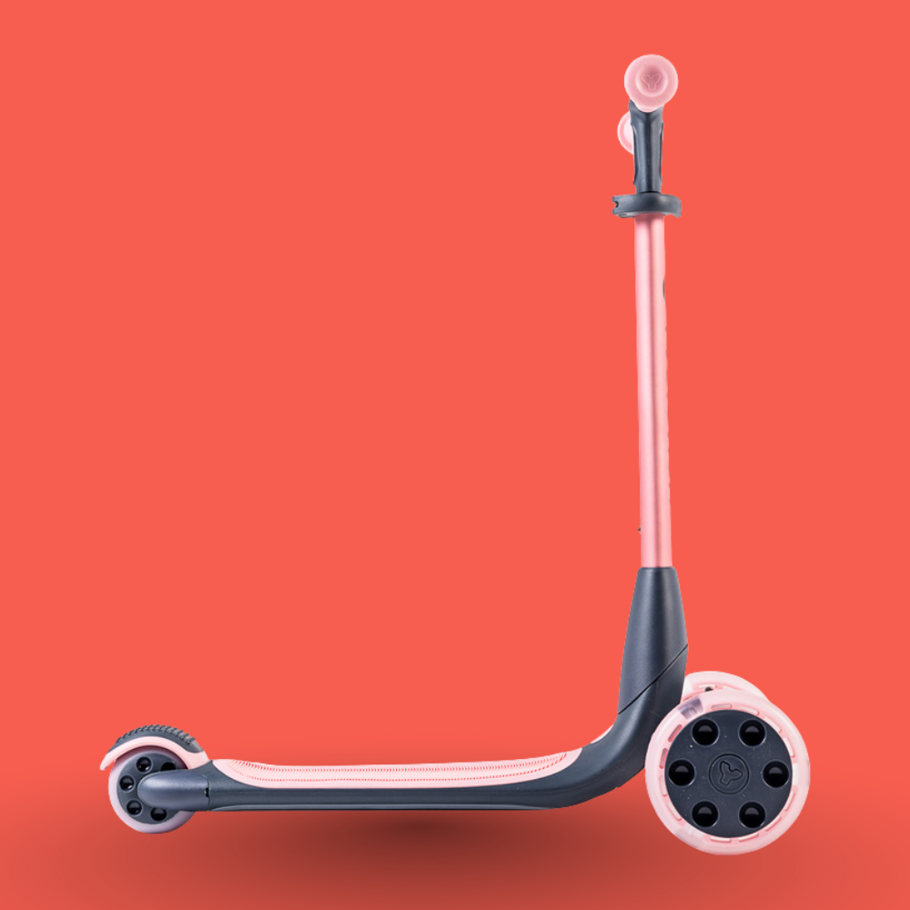 Children's scooter with pink and black design on a red background