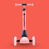 Pink scooter with black accents on a red background