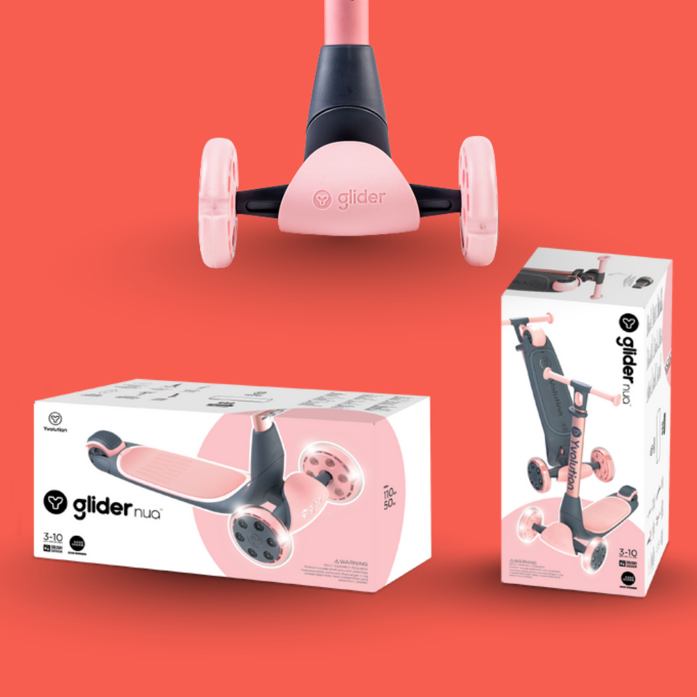 Pink and black scooter with packaging on a red background