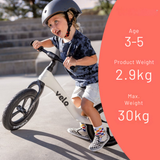Child riding a balance bike with product details on a pink circle overlay
