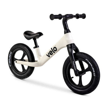 White balance bike with black wheels and handlebars on a white background