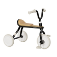 Children's tricycle with black frame and white wheels on a white background