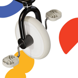 Close-up of a reel-to-reel tape player with colorful abstract shapes in the background