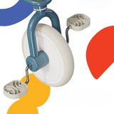 Toy tricycle with colorful abstract shapes on a white background