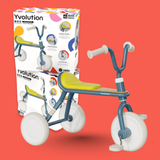 Children's tricycle with Yvolution packaging on a red background