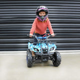 girl wearing a safety riding helmet while riding on a blue ATV
