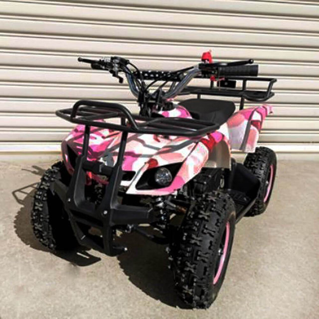 A pink 49cc petrol-powered 2-stroke farm-style quad bike for kids with knobby tyres and a steel grill tray at the rear.